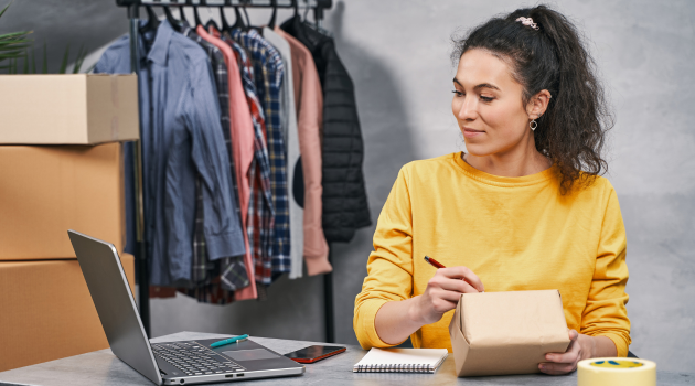 Entrepreneur handling e-commerce orders, representing outcomes like marketplace listing, customer growth, and competitive selling.