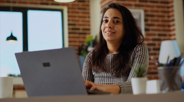 Woman learning social media marketing and AI tools to expand her online business.